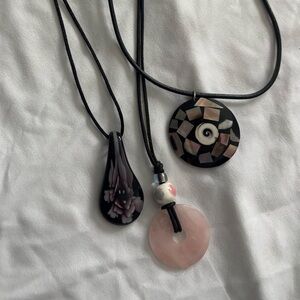 Bundle of three pendant and leather chain necklaces